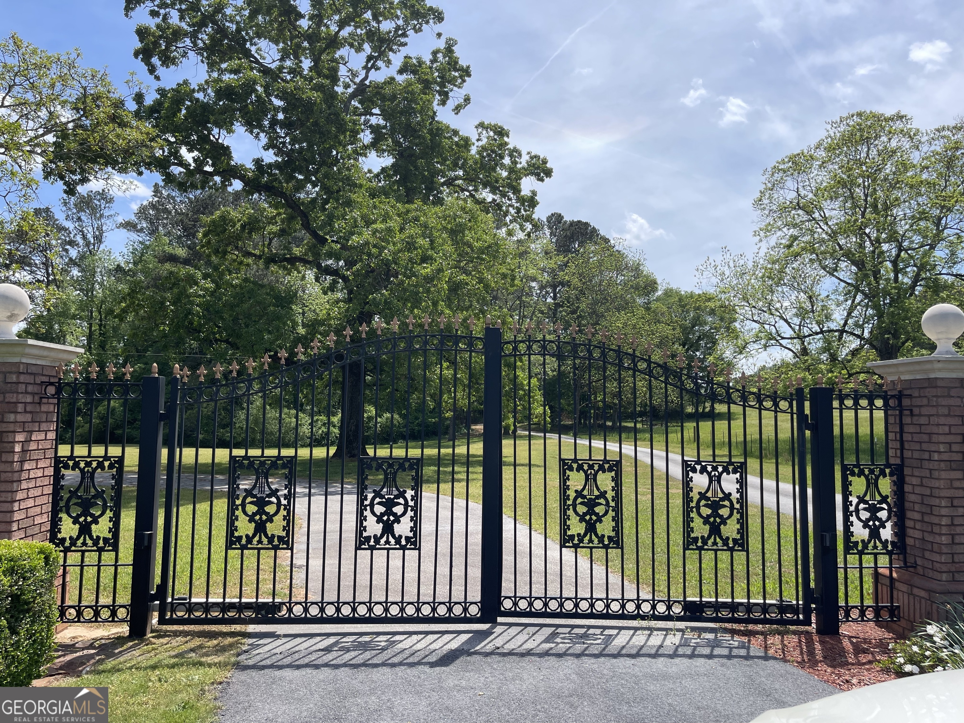 a view of a wrought iron fences in front of house