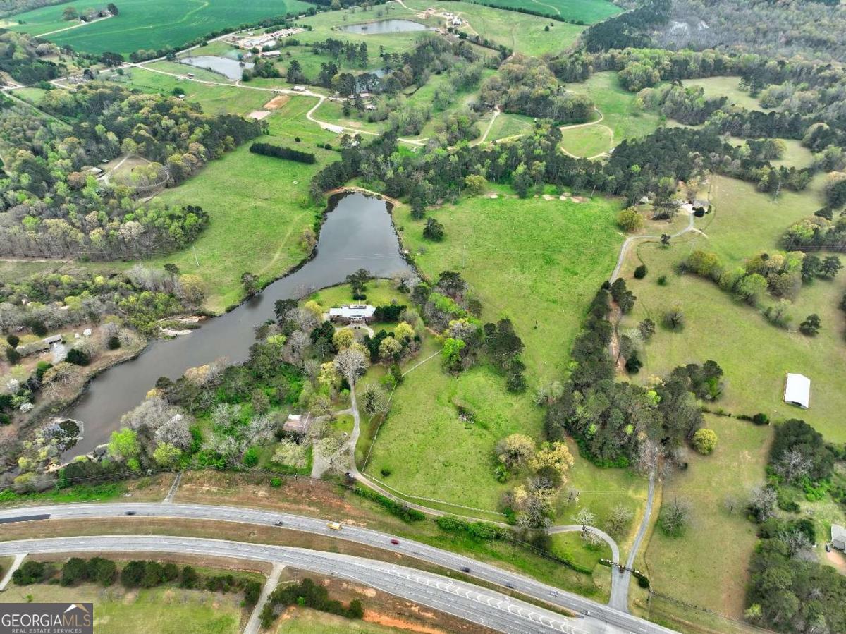 3571 Highway 20 Hampton, GA 30228 - Photo 22 of 35 an aerial view of a residential houses with yard