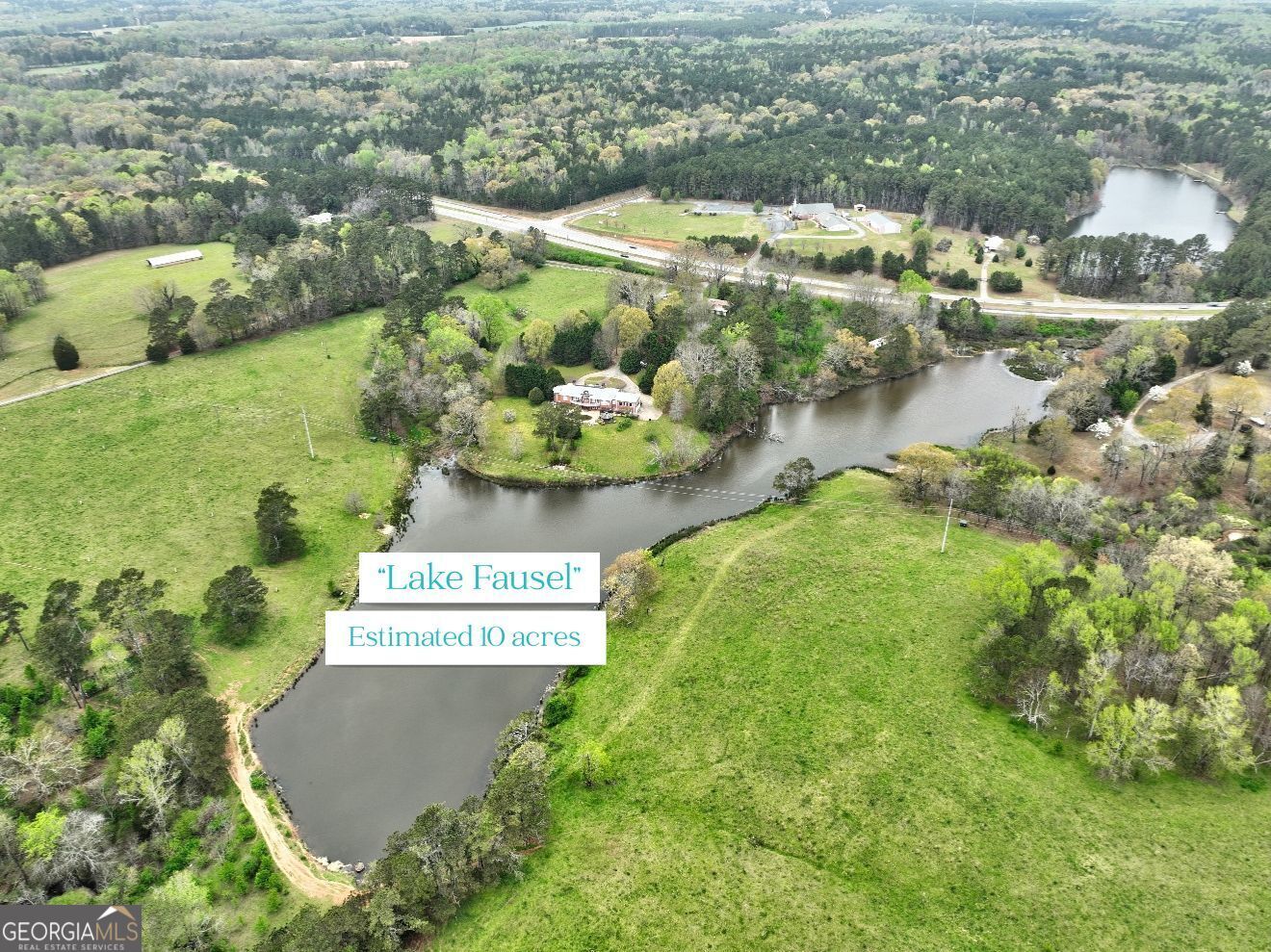 3571 Highway 20 Hampton, GA 30228 - Photo 4 of 35 an aerial view of residential houses with outdoor space