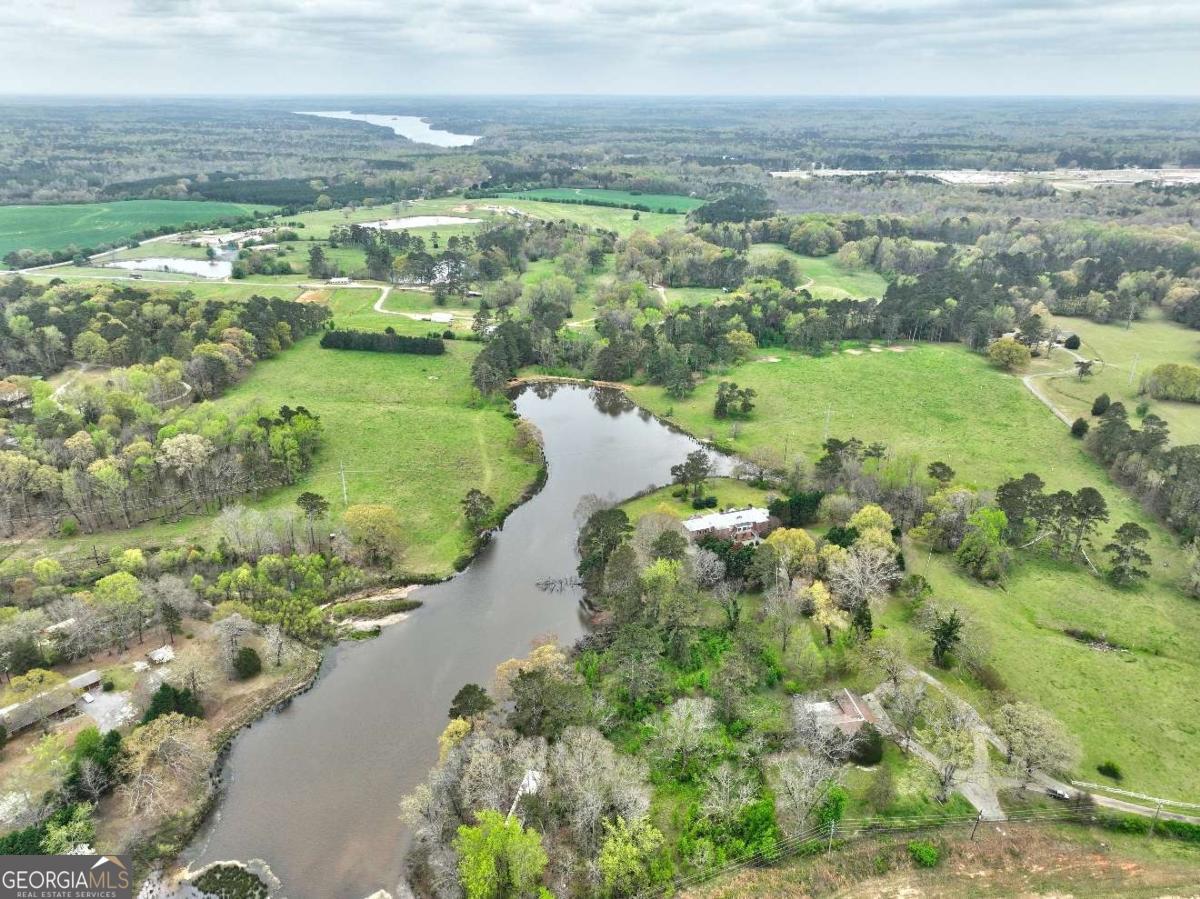 3571 Highway 20 Hampton, GA 30228 - Photo 9 of 35 a view of a lake with beach