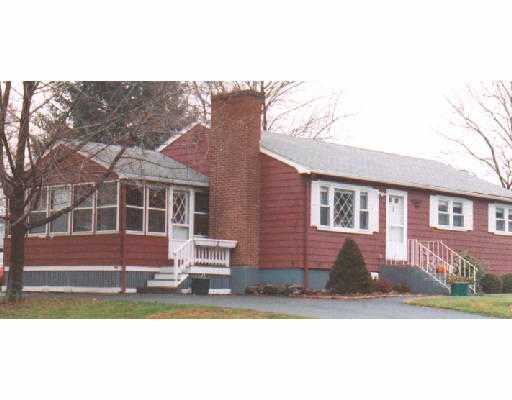 18 Bowman Road Billerica, MA 01821 - Photo 1 of 1 a front view of a house with a yard