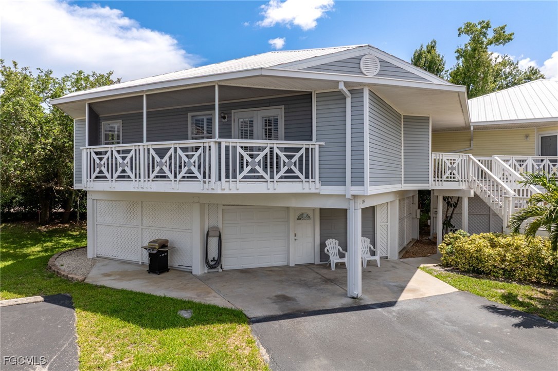 950 Moody Road, Unit 124 North Fort Myers, FL 33903 - Photo 1 of 44 front view of a house with a yard