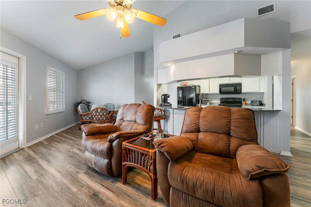 950 Moody Road, Unit 124 North Fort Myers, FL 33903 - Photo 11 of 44 a living room with furniture and a flat screen tv