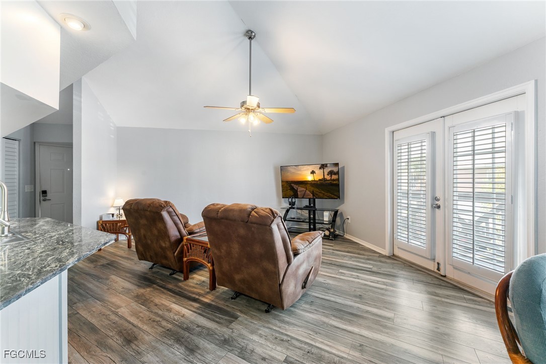 950 Moody Road, Unit 124 North Fort Myers, FL 33903 - Photo 12 of 44 a living room with furniture and a flat screen tv
