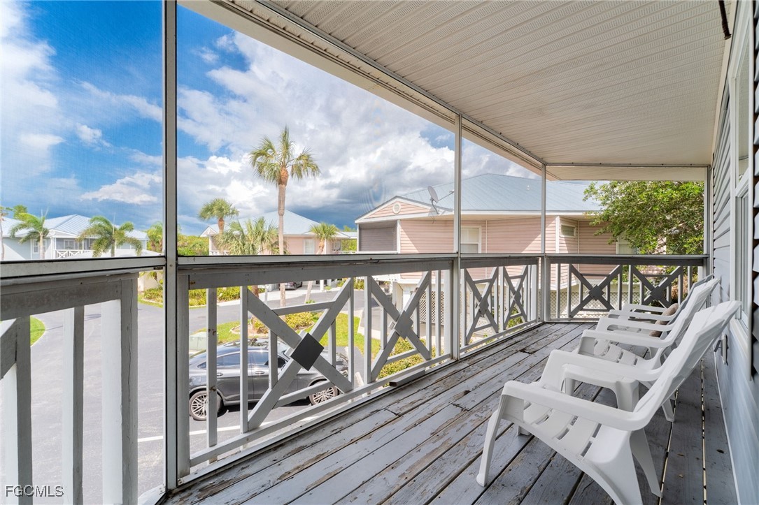 950 Moody Road, Unit 124 North Fort Myers, FL 33903 - Photo 13 of 44 a view of balcony with wooden floor