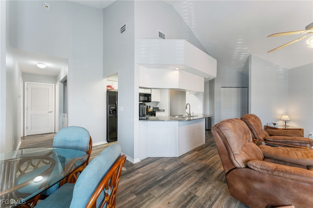 950 Moody Road, Unit 124 North Fort Myers, FL 33903 - Photo 14 of 44 a living room with furniture and a wooden floor
