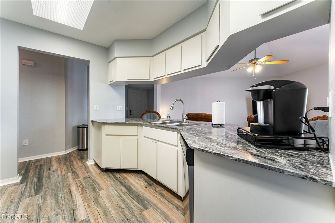 950 Moody Road, Unit 124 North Fort Myers, FL 33903 - Photo 18 of 44 a kitchen with sink and cabinets