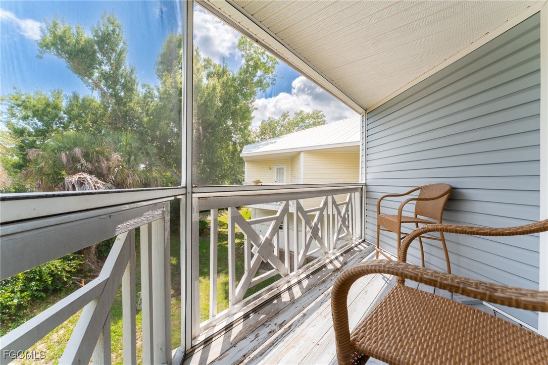 950 Moody Road, Unit 124 North Fort Myers, FL 33903 - Photo 23 of 44 a view of a balcony with furniture