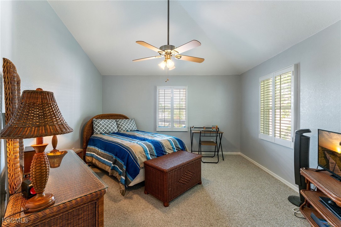 950 Moody Road, Unit 124 North Fort Myers, FL 33903 - Photo 26 of 44 a bedroom with a bed and a flat screen tv