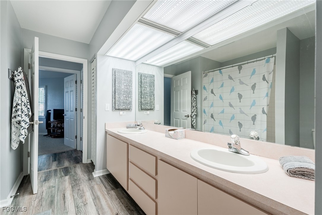 950 Moody Road, Unit 124 North Fort Myers, FL 33903 - Photo 27 of 44 a bathroom with a double vanity sink and mirror