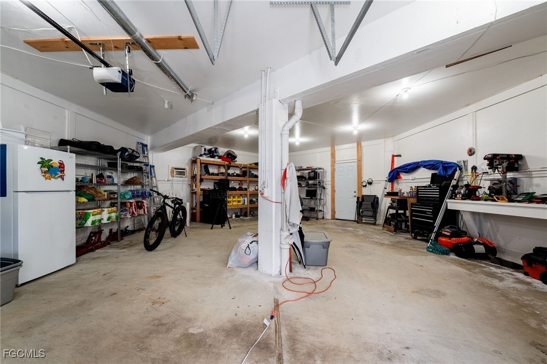 950 Moody Road, Unit 124 North Fort Myers, FL 33903 - Photo 33 of 44 a view of a garage with a bike and car
