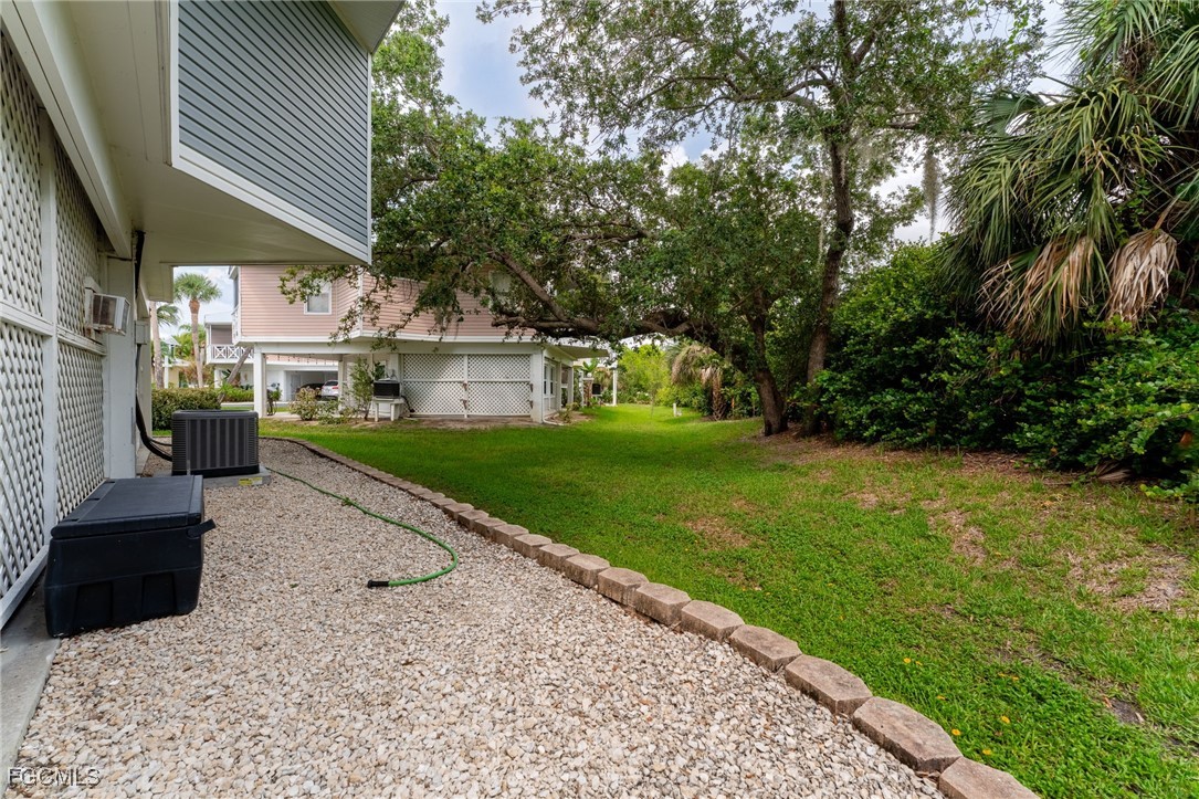950 Moody Road, Unit 124 North Fort Myers, FL 33903 - Photo 40 of 44 a front view of a house with a yard