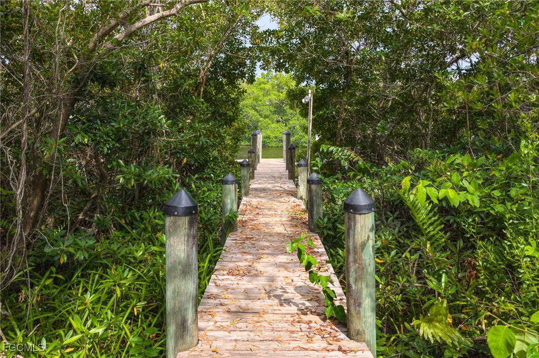 950 Moody Road, Unit 124 North Fort Myers, FL 33903 - Photo 5 of 44 a view of a pathway with a tree