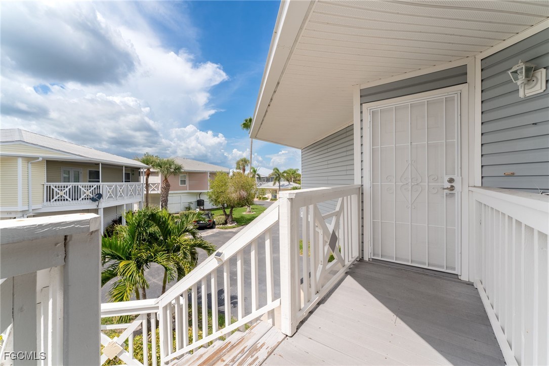 950 Moody Road, Unit 124 North Fort Myers, FL 33903 - Photo 7 of 44 a view of a house with porch and wooden floor