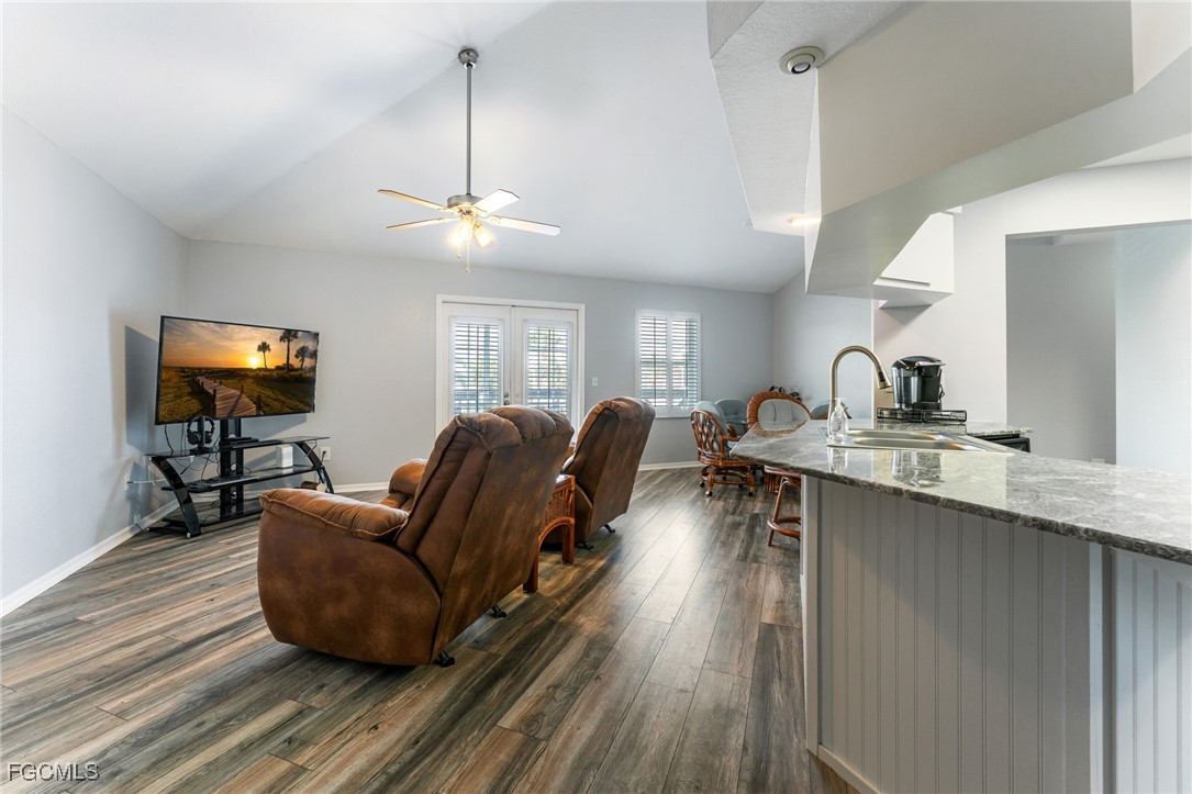 950 Moody Road, Unit 124 North Fort Myers, FL 33903 - Photo 9 of 44 a living room with couches a coffee table and a flat screen tv