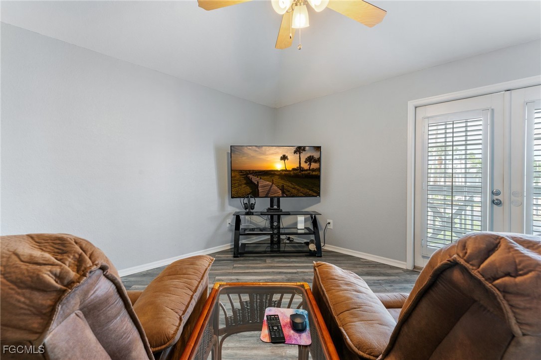 950 Moody Road, Unit 124 North Fort Myers, FL 33903 - Photo 10 of 44 a living room with furniture and a flat screen tv