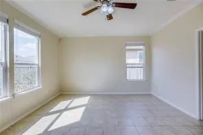 a view of room with a window and a ceiling fan