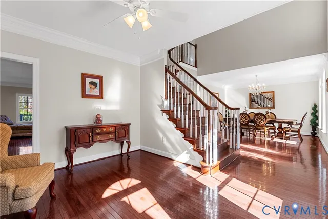 a view of a livingroom with furniture and hardwood floor