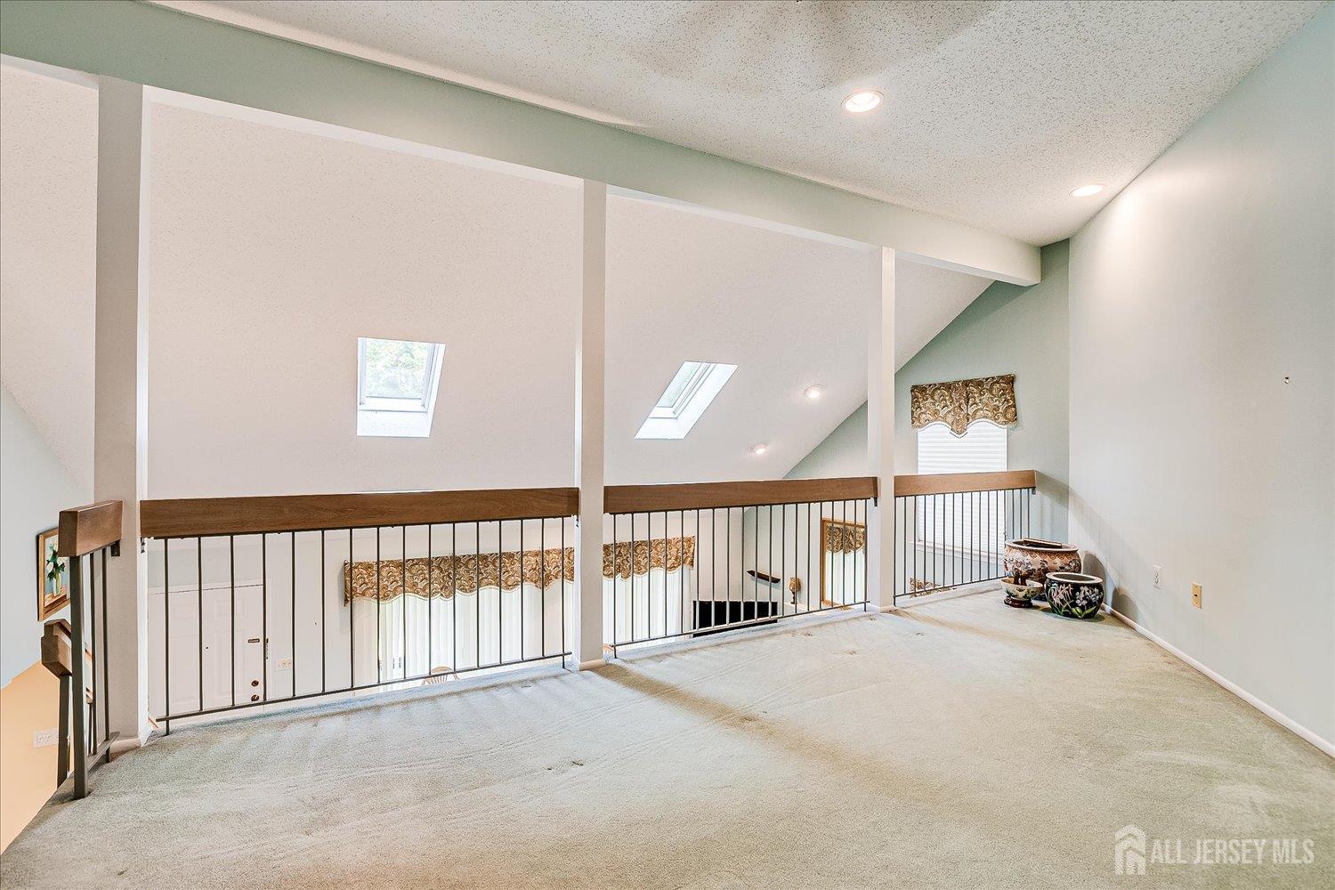 75 Kelly Drive Edison, NJ 08820 - Photo 23 of 41 a view of a hallway with windows