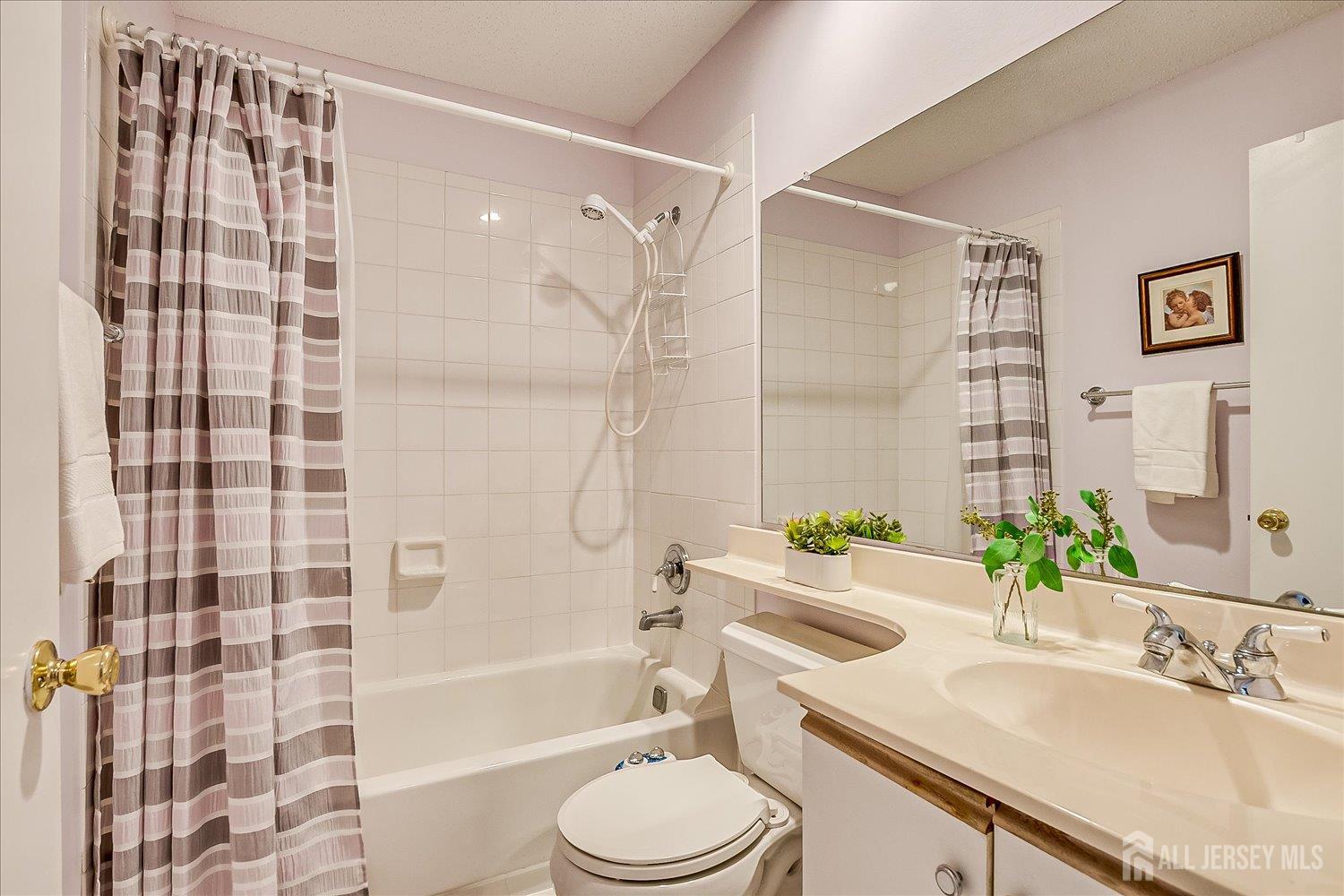 75 Kelly Drive Edison, NJ 08820 - Photo 27 of 41 a bathroom with a sink toilet and shower