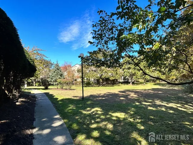 an aerial view of residential house with outdoor space and parking