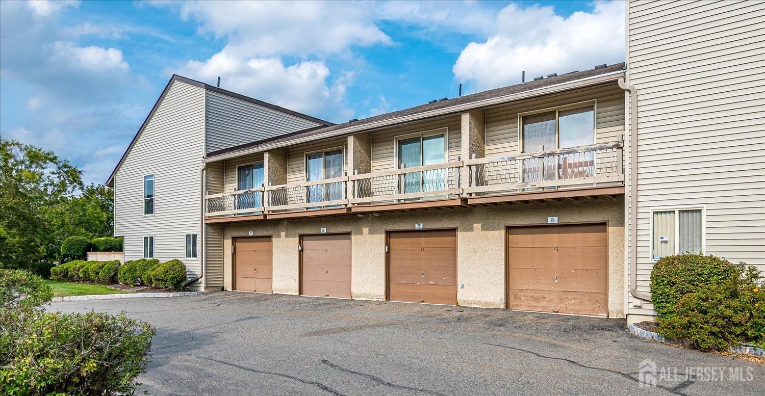 75 Kelly Drive Edison, NJ 08820 - Photo 35 of 41 a front view of a house with garden