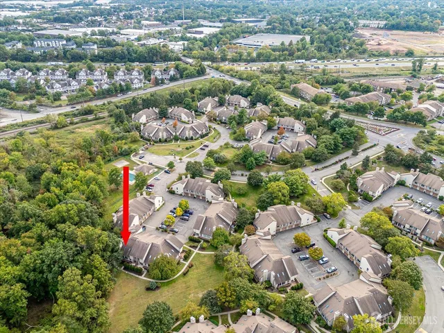 a sign that is sitting in front of flowers