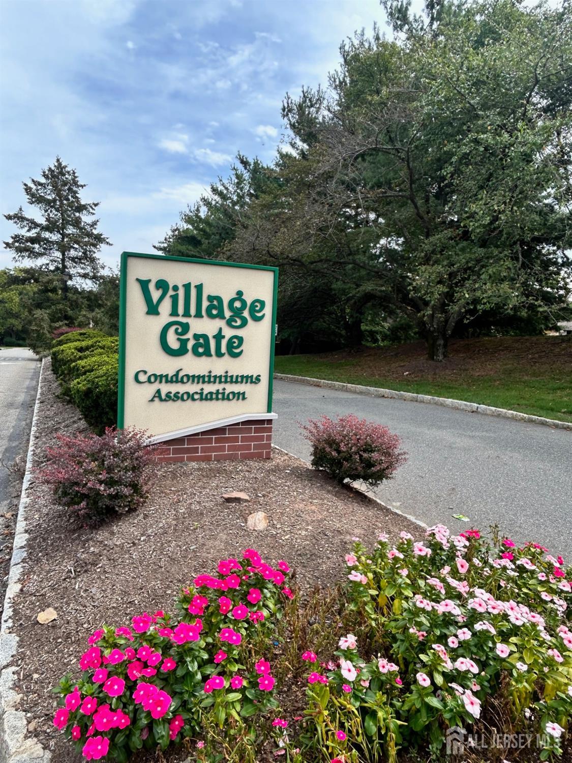 75 Kelly Drive Edison, NJ 08820 - Photo 38 of 41 a sign that is sitting in front of flowers