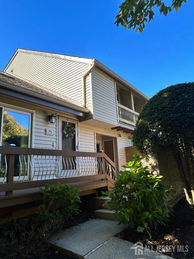75 Kelly Drive Edison, NJ 08820 - Photo 4 of 41 a front view of a house with garden
