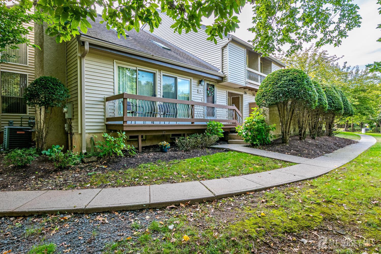 75 Kelly Drive Edison, NJ 08820 - Photo 5 of 41 a front view of a house with garden