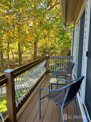 a view of a balcony with chairs