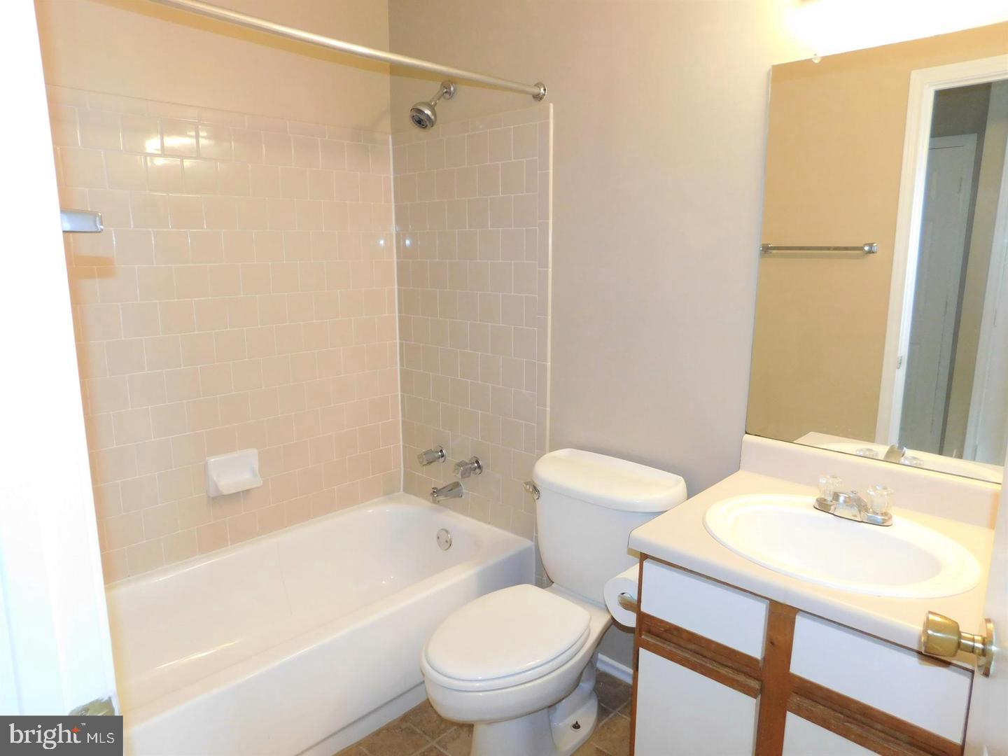 20958 Timber Ridge Terrace, Unit 203 Ashburn, VA 20147 - Photo 14 of 18 MASTER BATH WITH NEWER TILE FLOOR