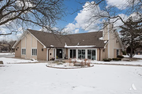 a view of a house with snow on the wall