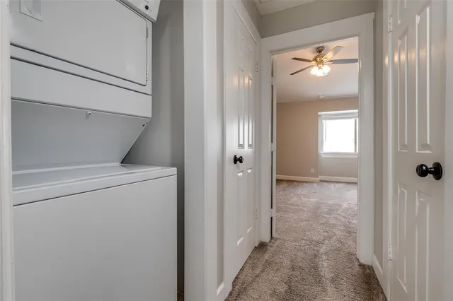 a bathroom with a granite countertop double vanity sink and a mirror