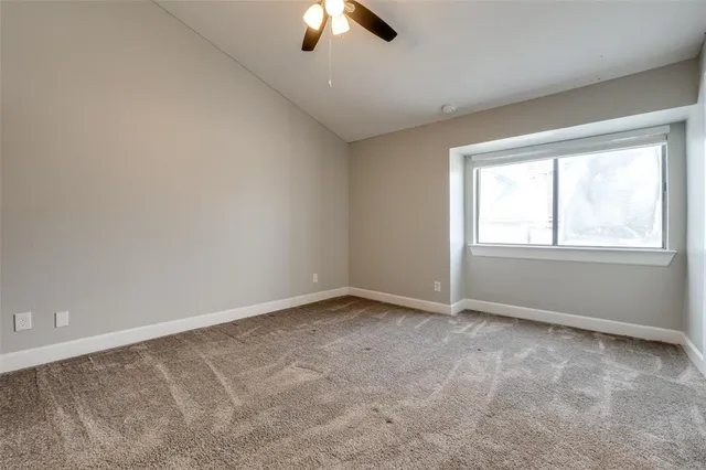 a view of a hallway with closet and wooden floor