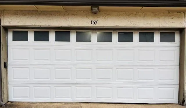 a couple of palm trees in front of house