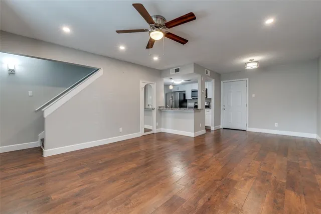 a view of kitchen with sink and wooden floor