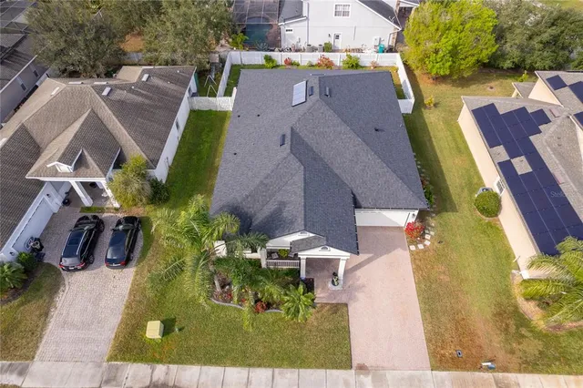 an aerial view of residential houses with outdoor space