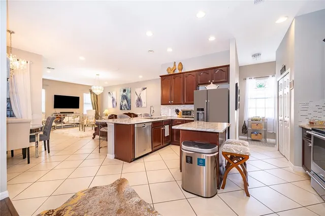 a kitchen with a sink cabinets and stainless steel appliances