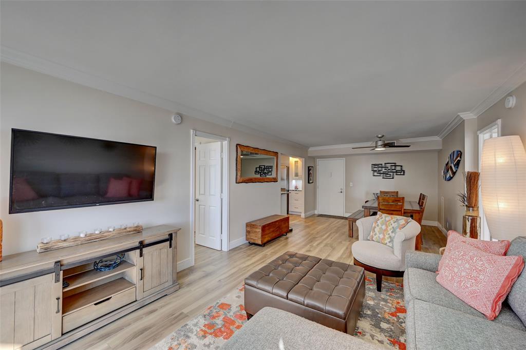 531 North Ocean Boulevard, Unit 506 Pompano Beach, FL 33062 - Photo 12 of 47 a living room with furniture and a flat screen tv