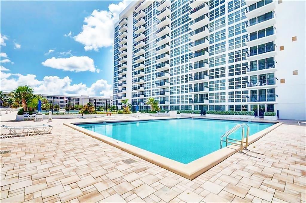 531 North Ocean Boulevard, Unit 506 Pompano Beach, FL 33062 - Photo 23 of 47 a view of swimming pool with outdoor seating