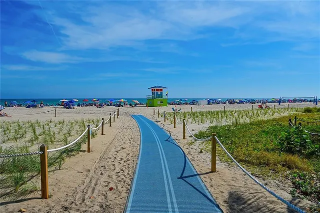 a view of bike storage next to a tall building