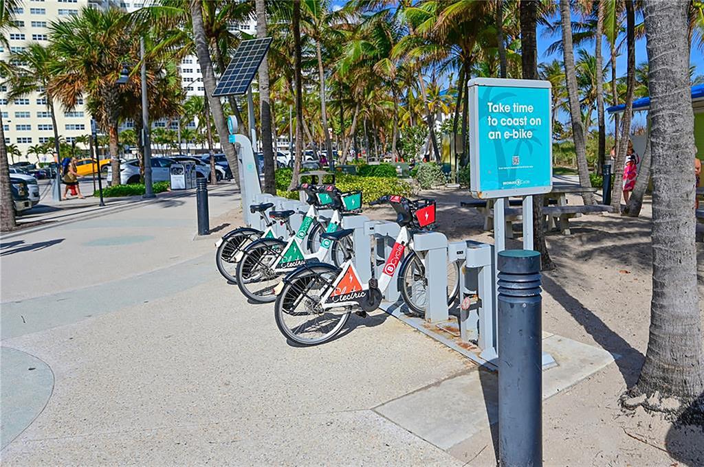 531 North Ocean Boulevard, Unit 506 Pompano Beach, FL 33062 - Photo 40 of 47 a view of bike storage next to a tall building