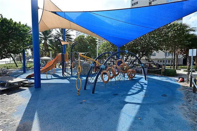 a view of outdoor space with a table and chairs