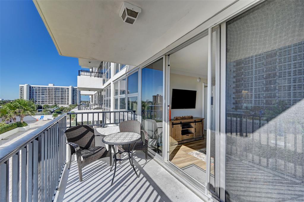 531 North Ocean Boulevard, Unit 506 Pompano Beach, FL 33062 - Photo 6 of 47 a balcony with furniture and a potted plant