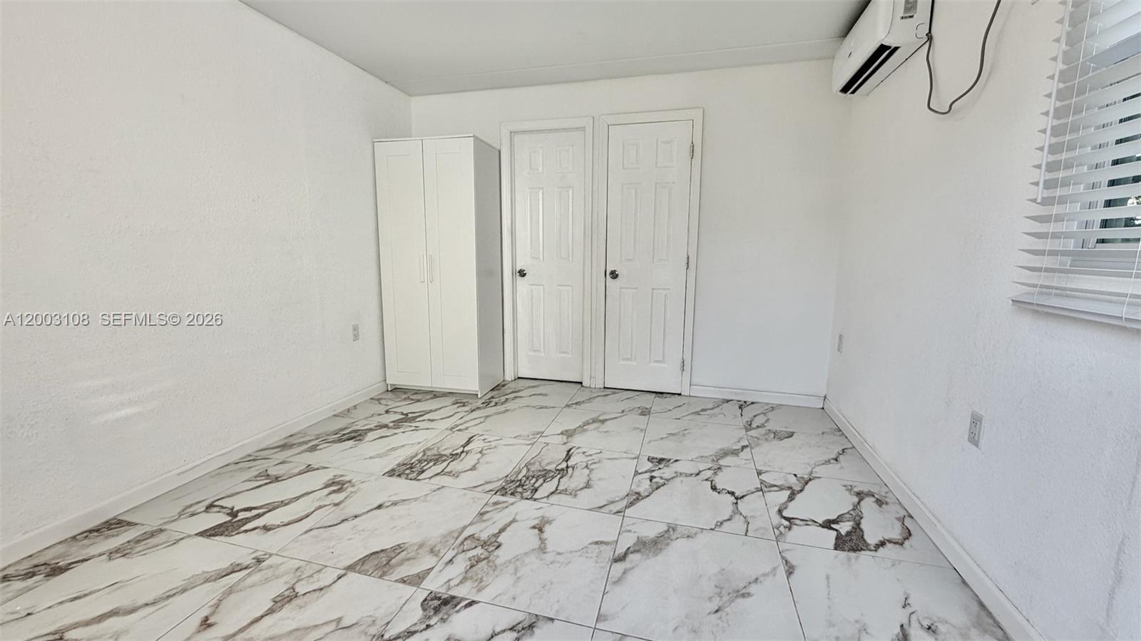 12435 Southwest 42nd Street, Unit 1 Miami, FL 33175 - Photo 2 of 7 a view of a bedroom
