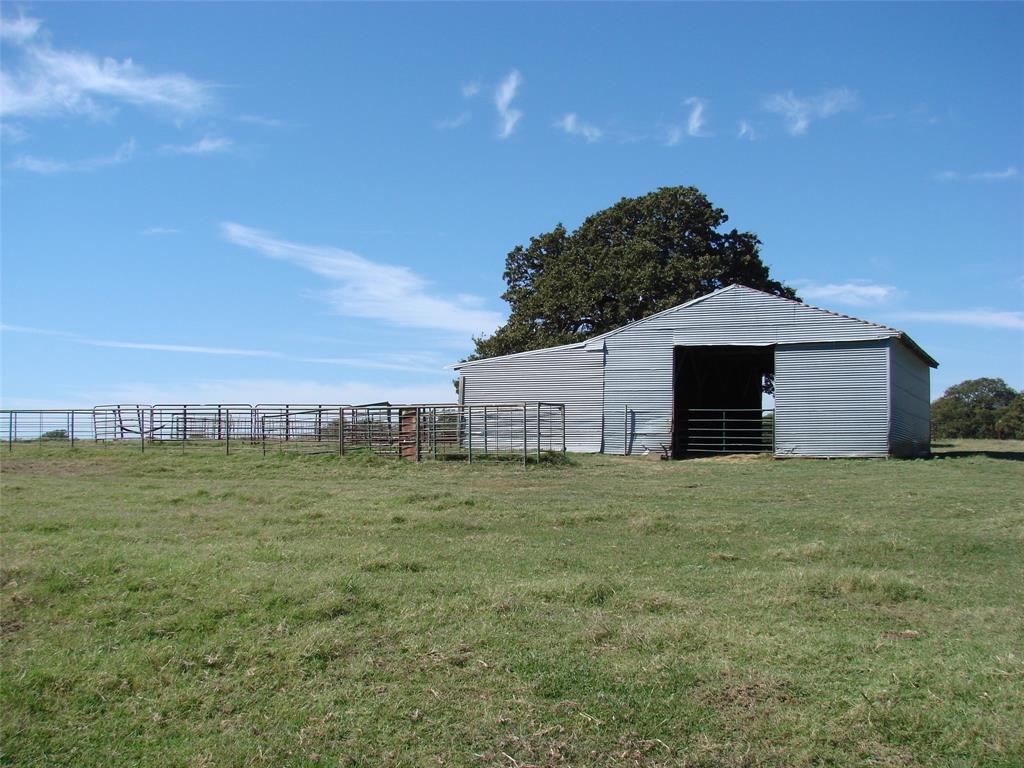 34 Denton Road Gordonville, TX 76245 - Photo 20 of 35 View of yard featuring a pole building and an outdoor structure