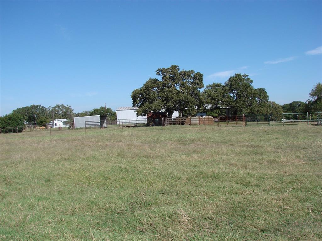 34 Denton Road Gordonville, TX 76245 - Photo 27 of 35 View of yard featuring an outbuilding and a view of countryside