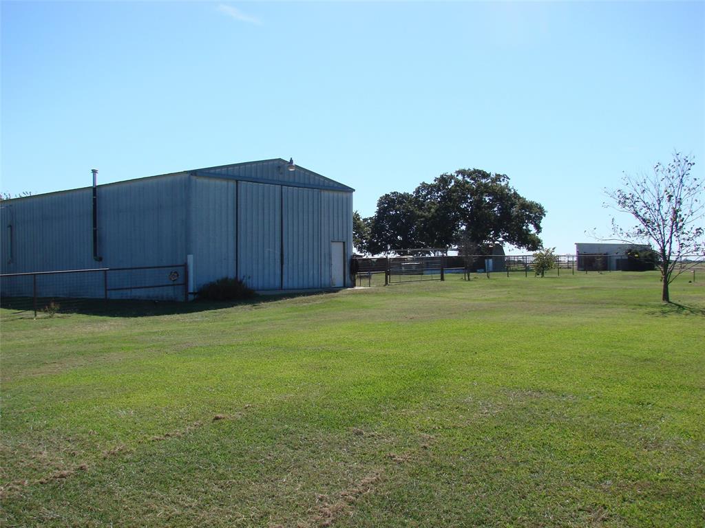 34 Denton Road Gordonville, TX 76245 - Photo 10 of 35 View of yard with a pole building and an outbuilding