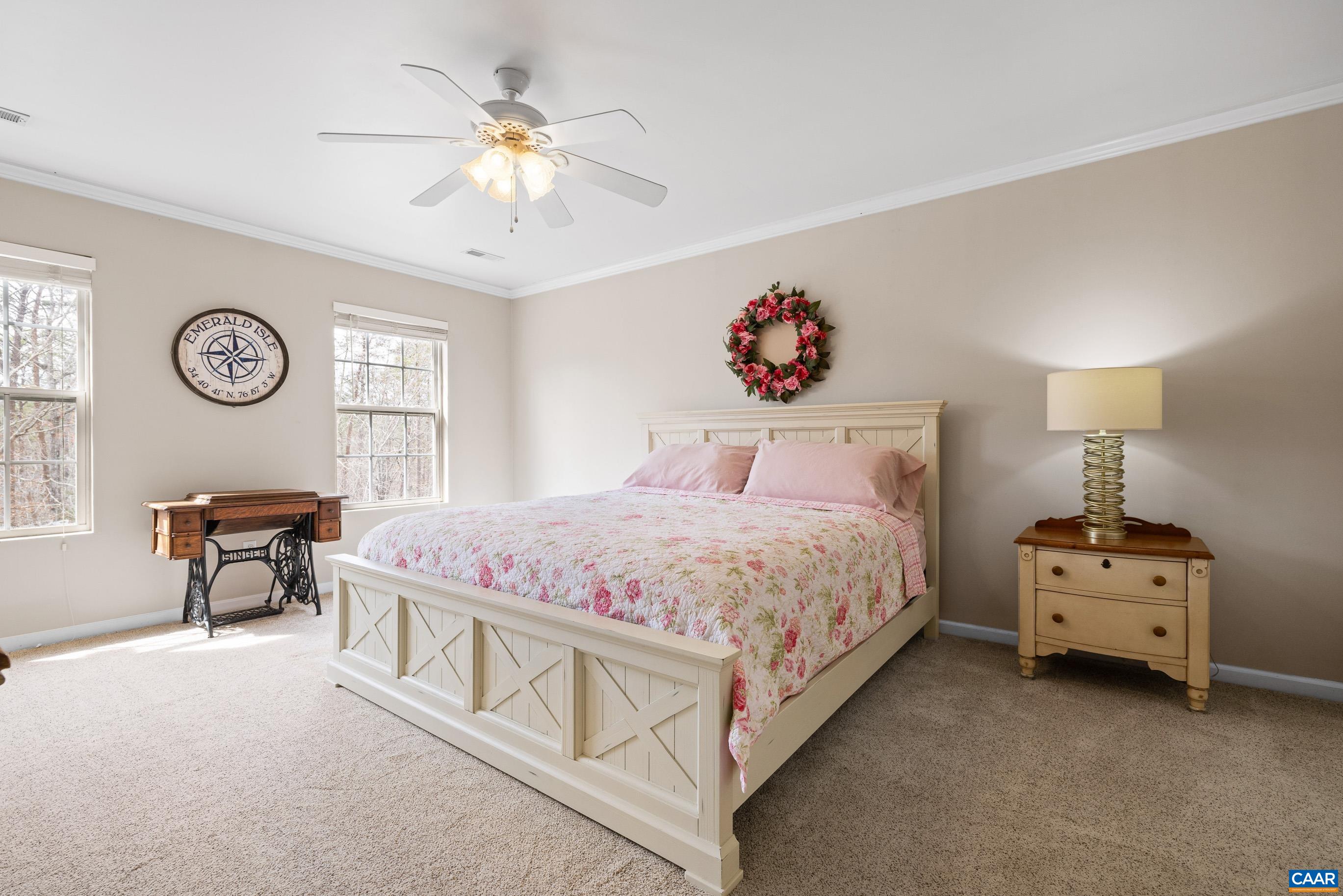 17 Hopi Way Palmyra, VA 22963 - Photo 24 of 36 a bedroom with a bed and a chandelier